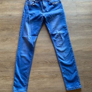 Distressed denim jeans